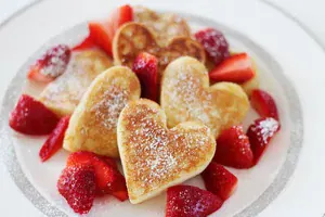 heart shaped pancakes with strawberries