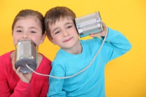 Kids Playing With Tin Can Telephones Auditory Learning