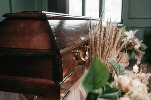 pexels-photo-7317677 a brown wooden coffin