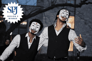 Two Kappa Alpha Psi members talk while wearing masks