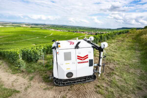 Most robots, including drones, driverless tractors, spraying robots, and UAVs, are used for field crop produce. This is Yanmar's YV01 autonomous vineyard spraying robot. - Photo: Yanmar