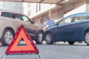 photo illustration of a car accident in the distance