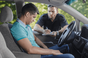 man getting pulled over by a police officer