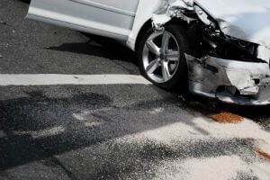 damage to front of car on road