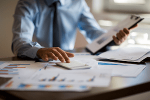 Man calculating costs 