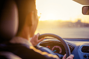 Driver behind the wheel on a sunny day