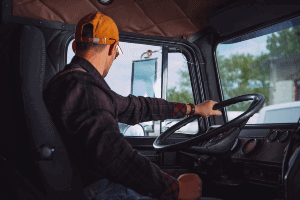 truck driver behind the wheel of a truck
