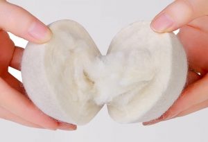 an image showing a dryer ball being torn apart