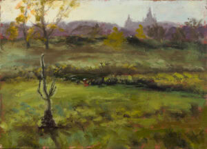 Misty autumn meadow with a solitary tree and distant church towers painted during a plein air session.