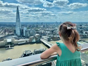 Little girl looking at London from above