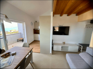 Loft Apartment Postira Wohnen-Küche-Balkon-TV
