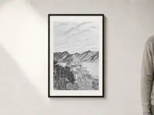 Disegno in carboncino della Chiesa Madonna del Sasso sopra Locarno, arroccata sulla collina con il Lago Maggiore e le montagne sullo sfondo, presentato con passepartout e cornice nera; dimensioni esterne 52 × 72 cm.