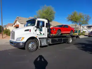 Freeway Towing & Storage flatbed tow truck responding to a breakdown along I-17 and the Loop 101 corridor in North Phoenix, Arizona