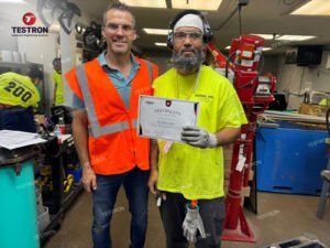 National Pipe & Plastics technician with Drop Weight Impact Testing Machine training certificate