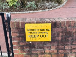 Keep out sign with graffiti