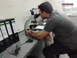 Technician operating TT-CBD 1000 Carbon Black Dispersion Detector for plastic testing