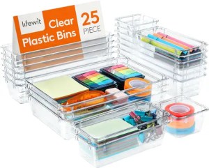 Clear plastic storage bins with colorful sticky notes, tabs, and organizing supplies for home or office organization. 25-piece set for clutter-free living.