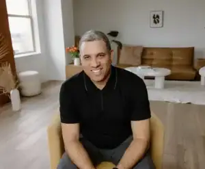 Mike parry sitting on a chair wearing a black tshirt