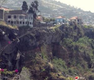 Cemetery to the left of 3 vans centre, on top of cliff.
