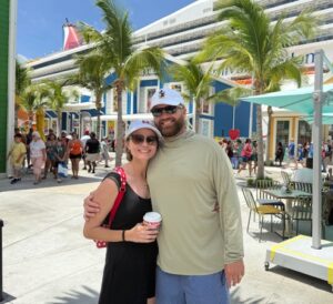 Vacation couple enjoying a sunny day at an outdoor tropical location in Florida.