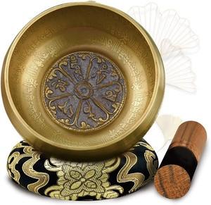 Nepal Singing Bowl, intricately designed traditional brass singing bowl with a wooden striker and cushion for sound resonance.