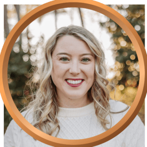 Smiling woman outdoors with fall foliage, representing vacation and travel services from 407 and Beyond Vacation Co.