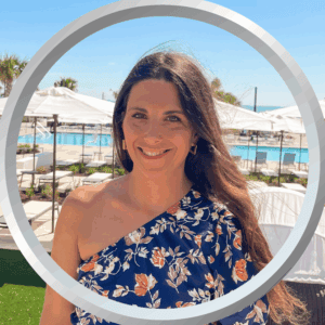 Relaxed woman enjoying sunny poolside at a luxurious resort in Florida.