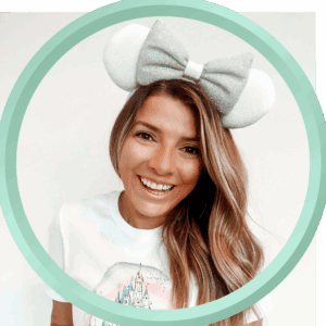 Cute woman with Minnie Mouse ears headband, Disney-themed vacation at 407 and Beyond Vacation Co.
