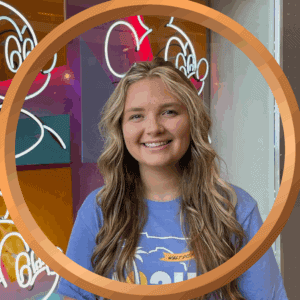 407vacations, fun Orlando vacation experience with Disney-themed neon signs in the background.