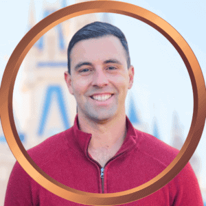 Friendly traveler in front of iconic Orlando landmark, representing expert vacation planning services.