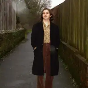 Adam Maghout is walking in a coat