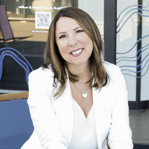 kimberly secord wearing a white shirt and blazer