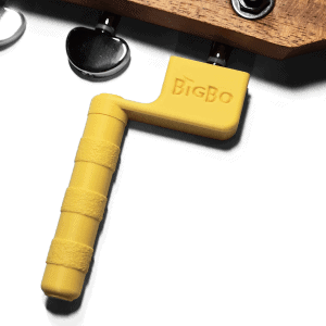 Guitar string winder in yellow winding guitar strings