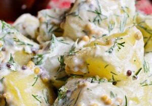 Potato salad with mustard seeds and white filling in rustic style
