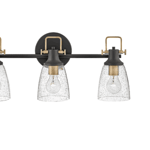 Easton 24-inch three-light vanity light in black with heritage brass accents and clear seedy glass shades