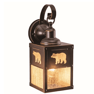 Rustic outdoor wall lantern featuring a burnished bronze finish, clear glass panels, and bear and tree silhouette inspired by wilderness design.