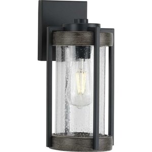 Whitmire 13-inch matte black outdoor wall lantern with clear seeded glass and wood-tone accents