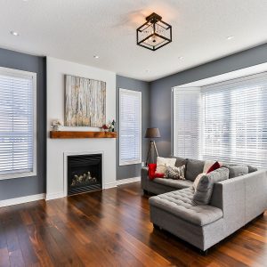 Living Room with dark Hardwood Floors and minimalist staging