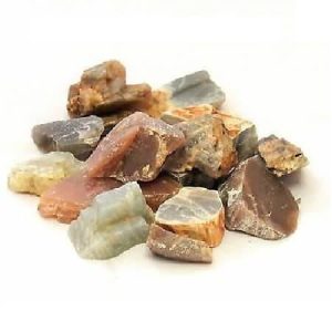Moonstone Rough, a collection of raw, unpolished moonstone stones with varied colors and textures.