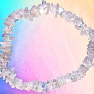 Selenite Chip Bracelet, handmade jewelry featuring irregularly shaped, translucent white selenite stones arranged in a circular bracelet on a pastel rainbow background.