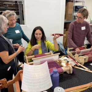 Woman weaving on loom