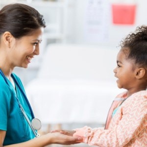 child with phlebotomist