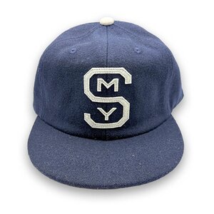 Navy wool snapback hat with hand-sewn SMY logo on front, vintage baseball style cap with structured crown and adjustable back, representing Smyrna, Georgia