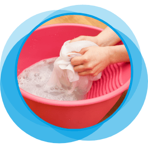 a woman hand-washing a garment