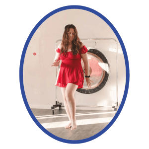 Meditative woman in red dress practicing mindfulness in wellness center, yoga and relaxation, holistic healing, calm mind, spiritual well-being, soulstice living, self-care, inner peace, soul-centered lifestyle, mental health awareness.