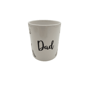 A mug with the word dad written on it.