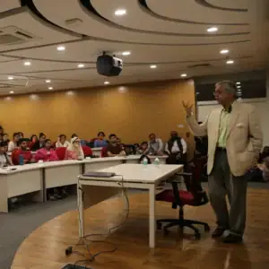 Professor delivering lecture to engaged students at Ashoka University classroom.