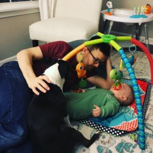 dad and son with boston terrier