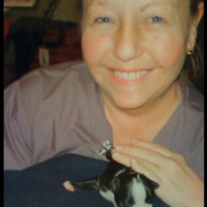 women holding a boston terrier puppy