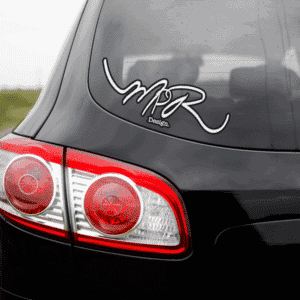 Black car with "MPR Design" sticker on the rear window.